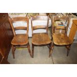 Three antique elm seated bar back kitchen chairs