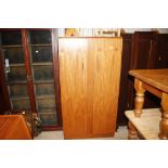 A teak hanging wardrobe