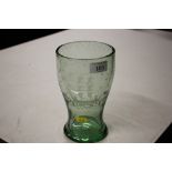 A green baluster glass vase with etched ship decor