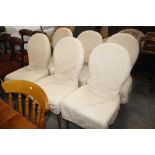 A set of six ochre upholstered dining chairs raise