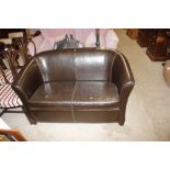 A leatherette upholstered two seater settee