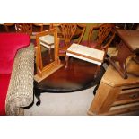 An oval mahogany coffee table; a pine framed swing