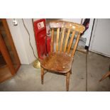 A Victorian elm seated slat back kitchen chair