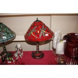 A red dragonfly decorated Tiffany style table lamp