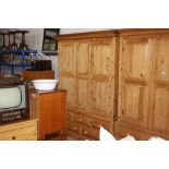 A good quality stripped pine wardrobe, fitted five