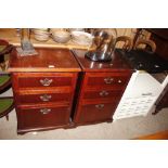 A pair of mahogany finish three drawer chests