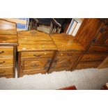 A pair of hardwood bedside chests