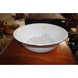 A white enamel wash bowl
