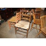 An elm and string seat pierced ladder back dining
