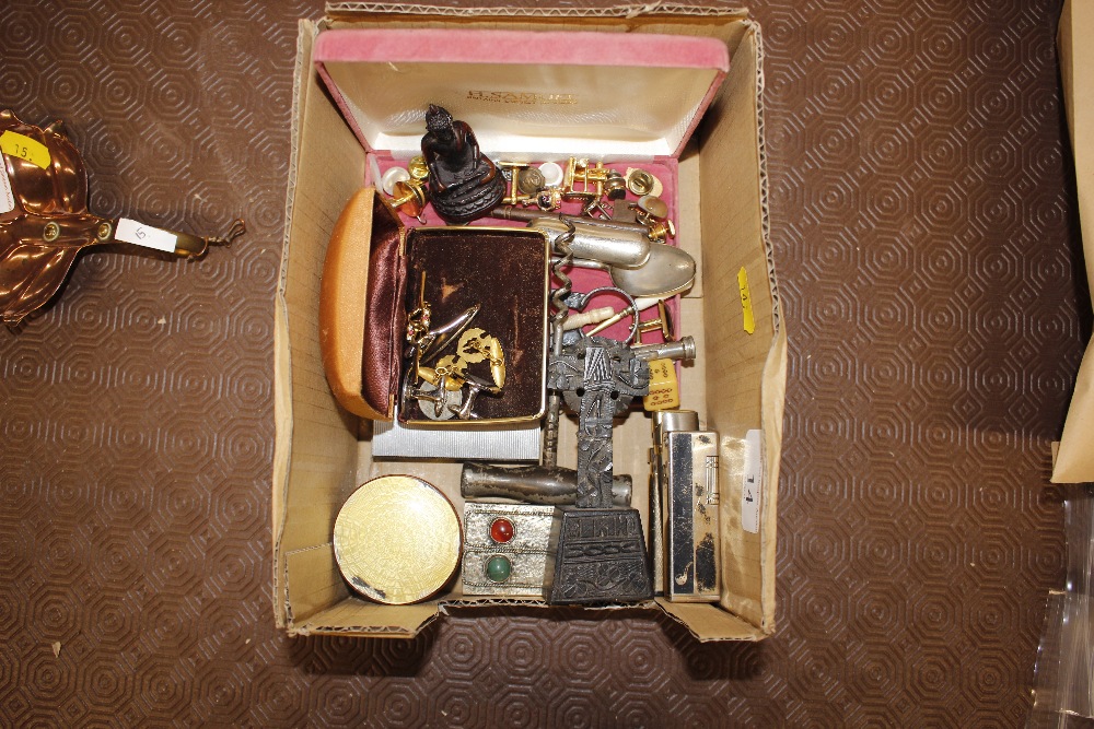 A box containing an enamel jar; lighters; cuff-lin