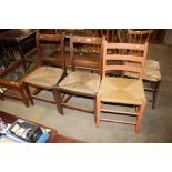 A pair of elm string seat dining chairs; and a