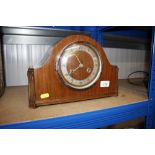 A 1930's walnut striking mantel clock
