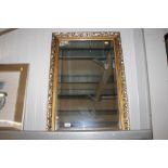 A gilt framed bevel edged wall mirror