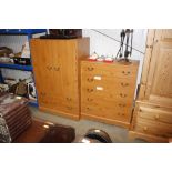 A modern pine effect five drawer chest and matchin