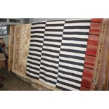 A black and white striped rug, approximately 7'10"