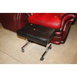 A leatherette and chrome upholstered stool