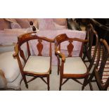 A pair of Edwardian inlaid corner chairs