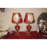 A pair of red Toleware type table lamps