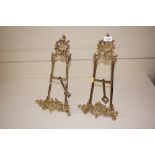 A pair of brass easel photograph stands