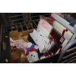 A box containing various stationery, soft toys etc