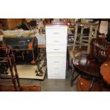 A pair of laminate three drawer chests