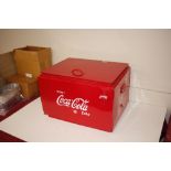 A reproduction Coca-Cola cool box