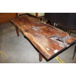 A rustic yew wood carved coffee table