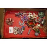 A collection of various vintage dress brooches