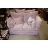A pink upholstered Knoll sofa