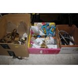 A box of brass light fittings; door handles; showe