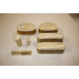 An ivory mounted part dressing table set