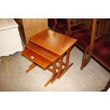 A nest of three teak coffee tables