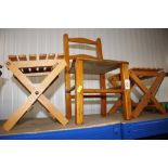 A child's wooden chair and two folding tables