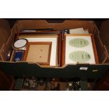 A box containing various photograph frames
