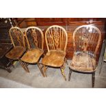 Four elm seated stick and wheel back dining chairs