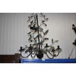 A wrought metal floral decorated ceiling light