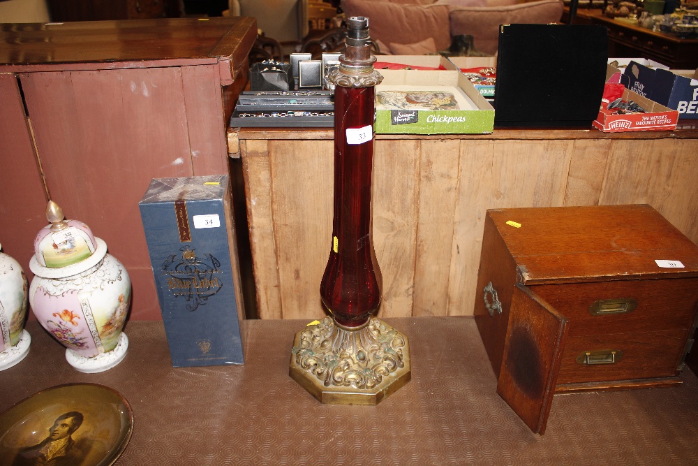 A 19th Century ruby glass lamp base AF