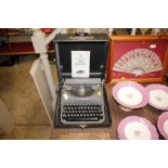 A Remington Rand portable typewriter and manual