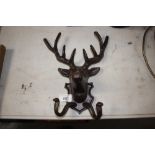 A cast iron stags head coat hook