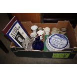 A box containing various Royal Commemorative mugs,