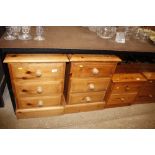 A pair of stripped pine bedside chests fitted thre