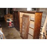 A pitched pine storage cabinet with three interior