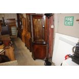 A reproduction mahogany corner cabinet