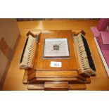 An oak Art Deco brush and barometer set