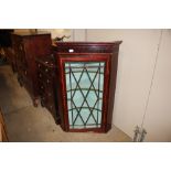 A mahogany satinwood strung hanging corner display