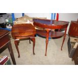 A mahogany effect two tier Demi Lune hall table; a