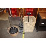 A brass folding spark guard; two wicker log basket