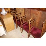 A set of five rail back dining chairs