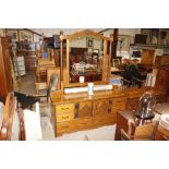 A hardwood dressing chest with mirror above