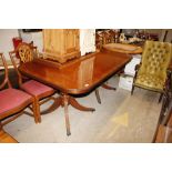 A reproduction yew wood D end dining table on twin